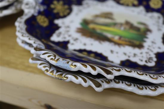 A Staffordshire dessert service, decorated in cobalt blue and gilt and painted topographical scenes